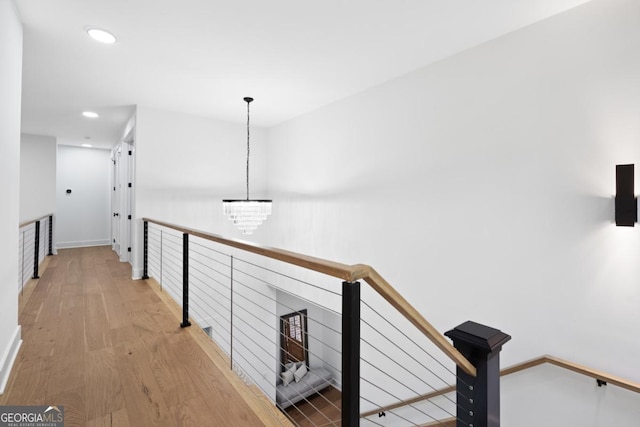 2595 Grassview Dr, Milton, GA 30004 - hall featuring an upstairs landing, light wood finished floors, a chandelier, recessed lighting, and baseboards