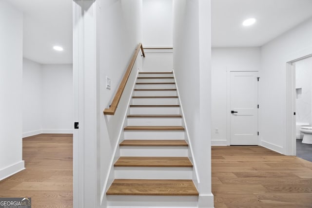 2595 Grassview Dr, Milton, GA 30004 - staircase with wood finished floors, recessed lighting, and baseboards