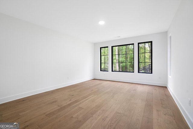 2595 Grassview Dr, Milton, GA 30004 - unfurnished room featuring wood finished floors, baseboards, and recessed lighting