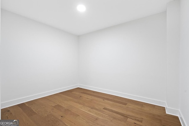 2595 Grassview Dr, Milton, GA 30004 - spare room with baseboards and wood finished floors