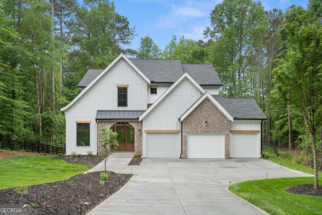 2595 Grassview Dr, Milton, GA 30004 - modern inspired farmhouse featuring french doors, roof with shingles, concrete driveway, a standing seam roof, and a garage