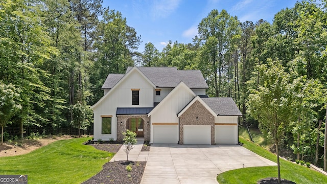 2595 Grassview Dr, Milton, GA 30004 - modern farmhouse style home featuring brick siding, roof with shingles, driveway, a front lawn, and an attached garage