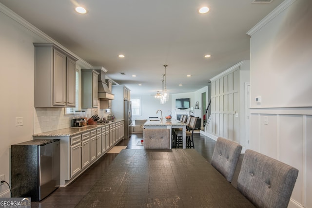 4752 Albany Way S, Fulton, GA 30331 - kitchen with gray cabinets, freestanding refrigerator, an island with sink, backsplash, and recessed lighting