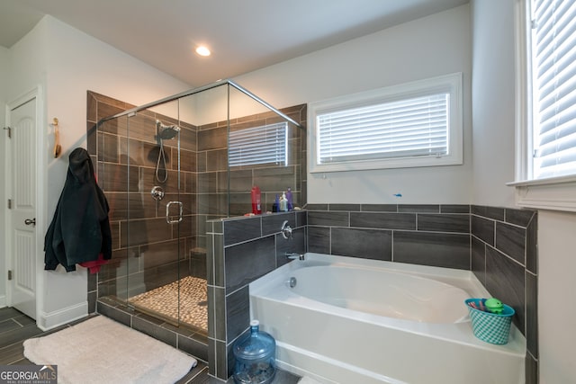 4752 Albany Way S, Fulton, GA 30331 - bathroom featuring a bath, healthy amount of natural light, a stall shower, and recessed lighting