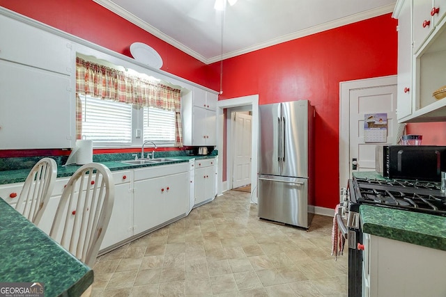 120 Newton St, Pooler, GA 31322 - kitchen with stainless steel appliances, a sink, crown molding, dark countertops, and white cabinets