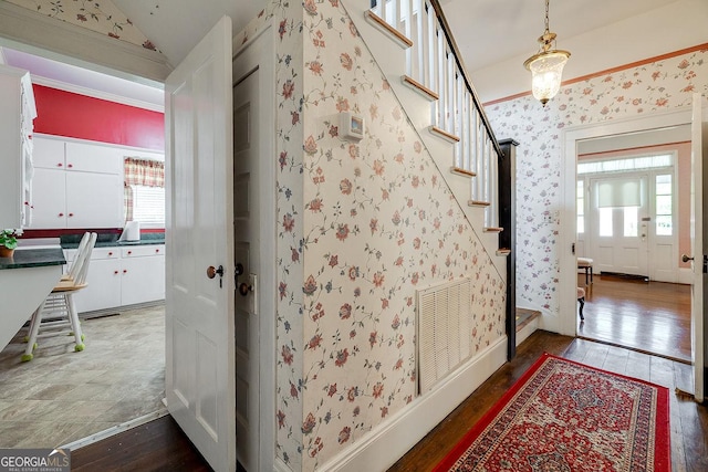 120 Newton St, Pooler, GA 31322 - foyer entrance featuring hardwood / wood-style floors, stairs, healthy amount of natural light, vaulted ceiling, and wallpapered walls