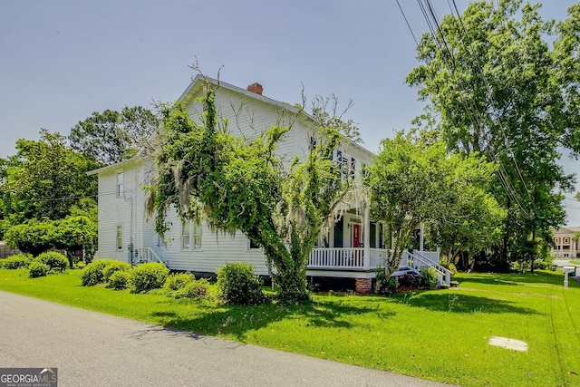 120 Newton St, Pooler, GA 31322 - view of property exterior featuring a yard, a chimney, and covered porch