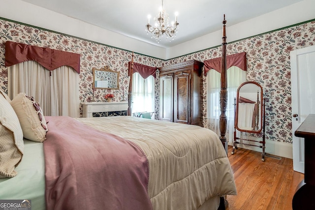 120 Newton St, Pooler, GA 31322 - bedroom with wallpapered walls, wood finished floors, and a chandelier