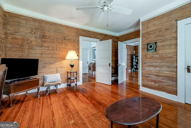 120 Newton St, Pooler, GA 31322 - sitting room featuring wood walls, a ceiling fan, and wood finished floors