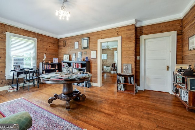 120 Newton St, Pooler, GA 31322 - living area with wooden walls, wood finished floors, and a chandelier