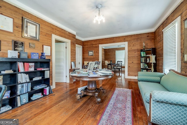 120 Newton St, Pooler, GA 31322 - living area with wooden walls, a chandelier, wood finished floors, and crown molding