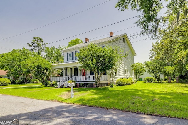 120 Newton St, Pooler, GA 31322 - view of front facade featuring covered porch, a front lawn, and a chimney