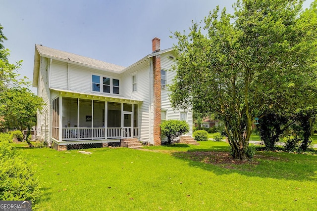 120 Newton St, Pooler, GA 31322 - back of property with a chimney, a sunroom, and a lawn