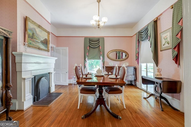 120 Newton St, Pooler, GA 31322 - dining space featuring wood finished floors, a chandelier, and a fireplace