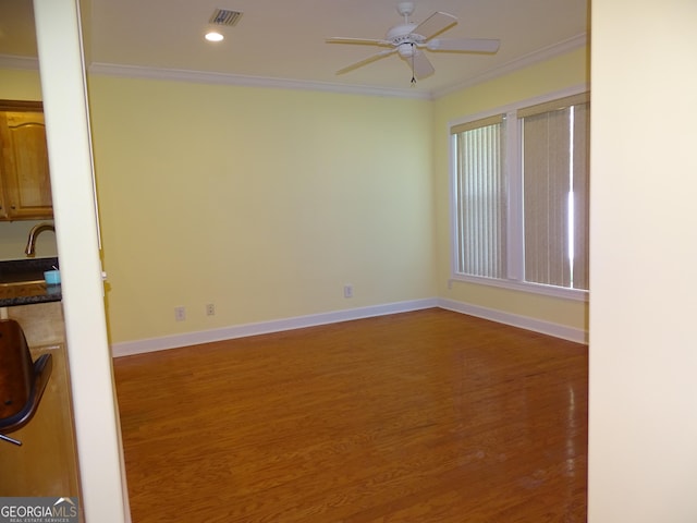 228 Laurel Landing Blvd, Kingsland, GA 31548 - unfurnished room featuring crown molding, wood finished floors, a ceiling fan, baseboards, and recessed lighting