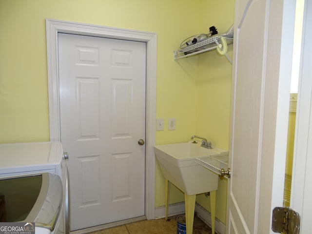 228 Laurel Landing Blvd, Kingsland, GA 31548 - laundry room with washing machine and dryer and light tile patterned floors
