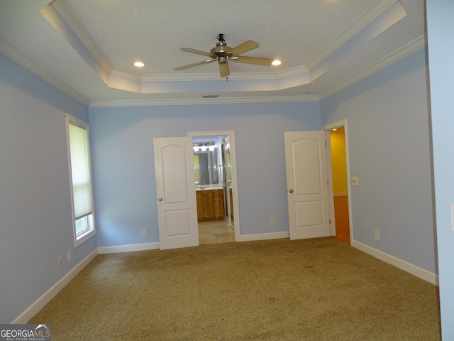 228 Laurel Landing Blvd, Kingsland, GA 31548 - unfurnished bedroom featuring a raised ceiling, ornamental molding, carpet floors, recessed lighting, and ensuite bath