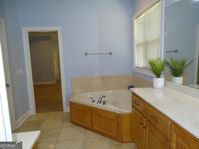 228 Laurel Landing Blvd, Kingsland, GA 31548 - full bath with a whirlpool tub, vanity, tile patterned flooring, and baseboards