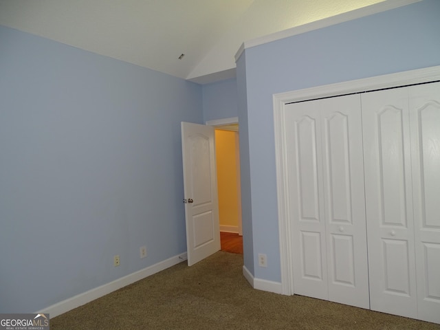 228 Laurel Landing Blvd, Kingsland, GA 31548 - unfurnished bedroom featuring carpet, a closet, lofted ceiling, and baseboards