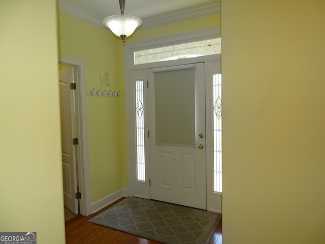 228 Laurel Landing Blvd, Kingsland, GA 31548 - foyer featuring crown molding, dark wood finished floors, and baseboards