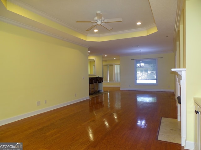 228 Laurel Landing Blvd, Kingsland, GA 31548 - unfurnished living room with hardwood / wood-style floors, ornamental molding, a raised ceiling, recessed lighting, and a ceiling fan