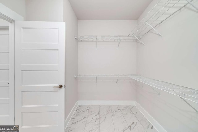 8370 Pleasant Grove Cir, Gainesville, GA 30506 - spacious closet featuring light marble finish flooring