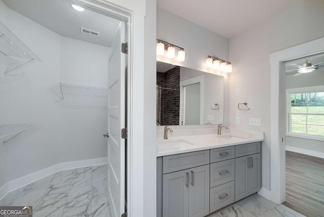 8370 Pleasant Grove Cir, Gainesville, GA 30506 - full bath with marble look tile flooring, double vanity, tiled shower, a walk in closet, and a ceiling fan