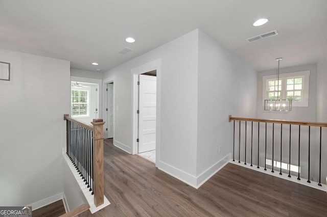 8370 Pleasant Grove Cir, Gainesville, GA 30506 - hall featuring an upstairs landing, a chandelier, wood finished floors, healthy amount of natural light, and recessed lighting