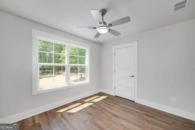 8370 Pleasant Grove Cir, Gainesville, GA 30506 - unfurnished room with wood finished floors and ceiling fan
