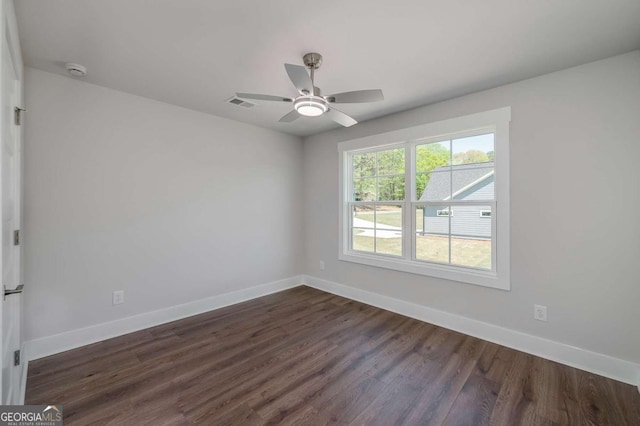 8370 Pleasant Grove Cir, Gainesville, GA 30506 - empty room with dark wood finished floors, a smoke detector, and a ceiling fan