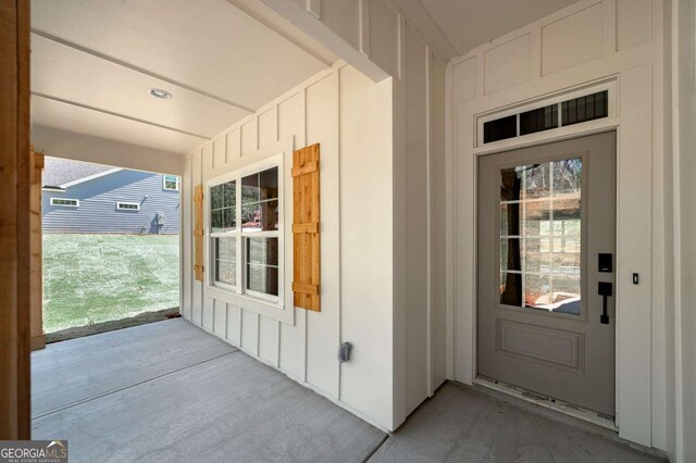 8370 Pleasant Grove Cir, Gainesville, GA 30506 - property entrance with a porch and board and batten siding