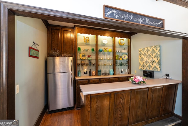 1701 City Blvd, Waycross, GA 31501 - bar with freestanding refrigerator and dark wood finished floors