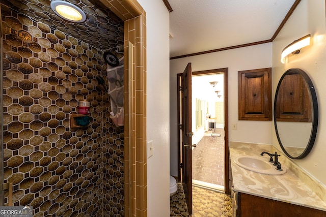 1701 City Blvd, Waycross, GA 31501 - bathroom with vanity, tiled shower, and ornamental molding