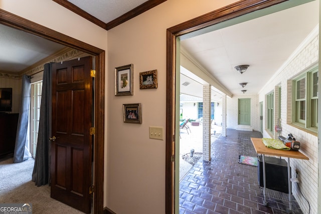 1701 City Blvd, Waycross, GA 31501 - hall featuring crown molding, healthy amount of natural light, brick floors, and baseboards