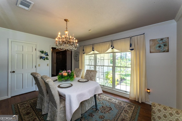 1701 City Blvd, Waycross, GA 31501 - dining space with ornamental molding, a chandelier, and dark wood-style flooring