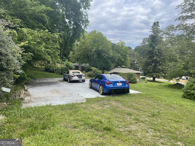 3629 Centerview Dr, Marietta, GA 30066 - view of grassy yard featuring a wooded view