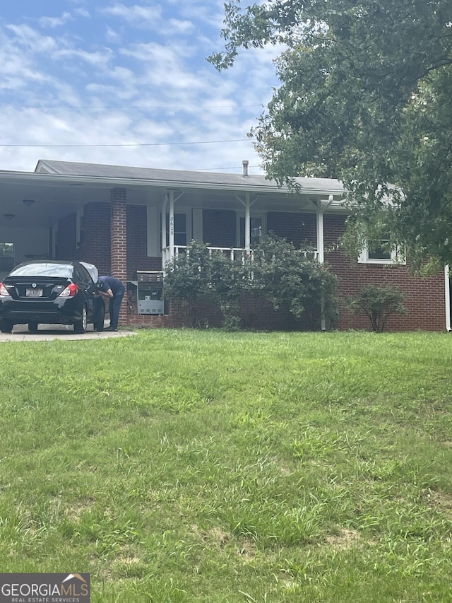 3629 Centerview Dr, Marietta, GA 30066 - ranch-style house with brick siding, a front lawn, and covered porch