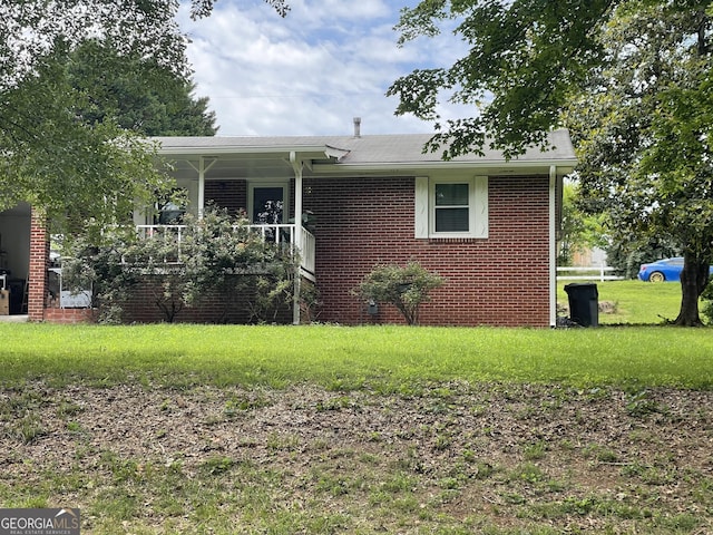 3629 Centerview Dr, Marietta, GA 30066 - ranch-style home featuring brick siding, a front yard, and covered porch