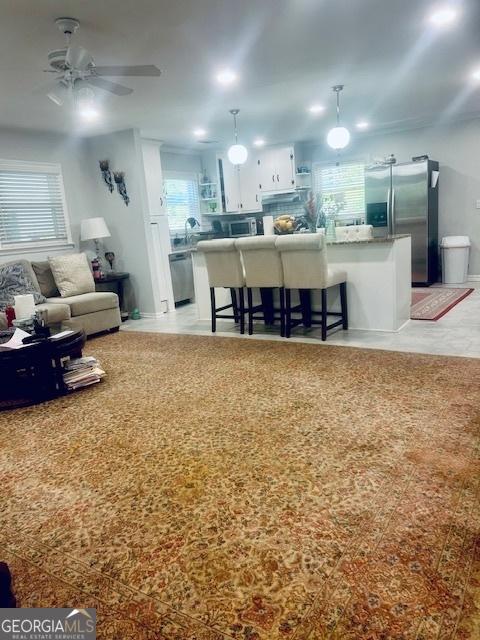 3629 Centerview Dr, Marietta, GA 30066 - living area featuring ceiling fan and plenty of natural light