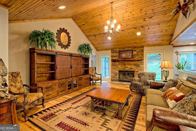 2877 Cynth Creek Rd, Hiawassee, GA 30546 - living area featuring wooden ceiling, a chandelier, wood finished floors, lofted ceiling, and a stone fireplace