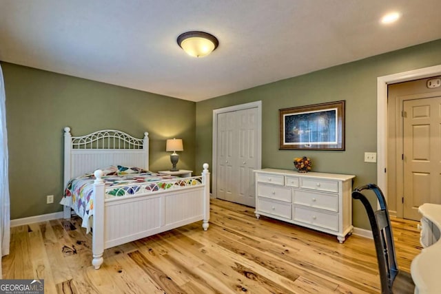 2877 Cynth Creek Rd, Hiawassee, GA 30546 - bedroom featuring light wood-style floors, baseboards, and a closet