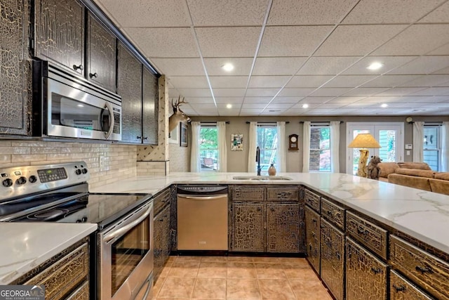 2877 Cynth Creek Rd, Hiawassee, GA 30546 - kitchen with stainless steel appliances, a sink, a paneled ceiling, open floor plan, and recessed lighting