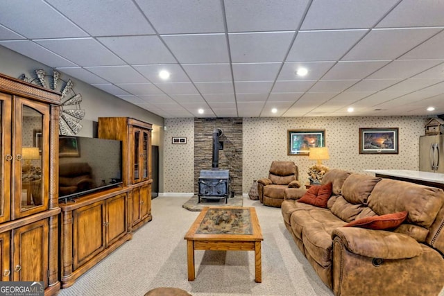 2877 Cynth Creek Rd, Hiawassee, GA 30546 - living room with a wood stove, light carpet, wallpapered walls, recessed lighting, and a drop ceiling