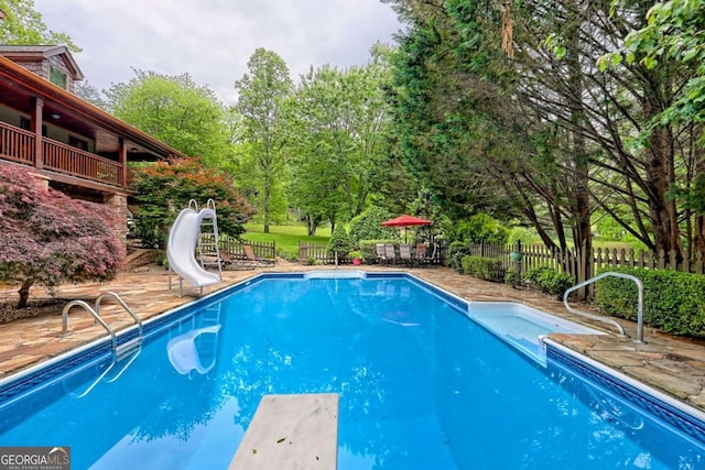 2877 Cynth Creek Rd, Hiawassee, GA 30546 - view of pool with a water slide, a diving board, a patio, and view of scattered trees