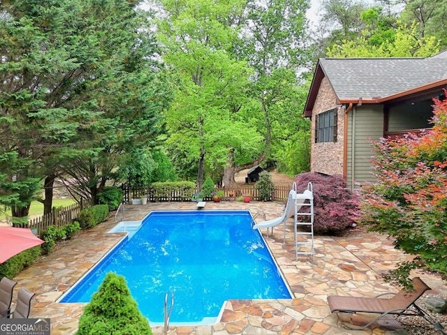 2877 Cynth Creek Rd, Hiawassee, GA 30546 - view of swimming pool featuring a water slide, a patio area, and a fenced backyard