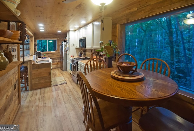 407 Hillside Dr, Clayton, GA 30525 - dining space with light wood-style flooring, wood walls, wooden ceiling, and recessed lighting