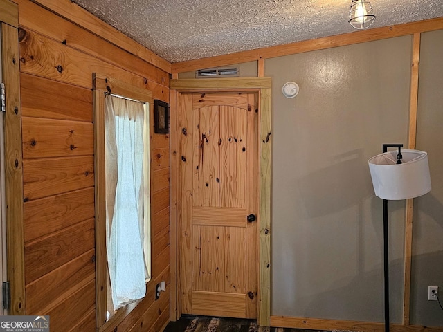 536 Gov Seay Rd, Collins, GA 30421 - foyer featuring a textured ceiling and wooden walls