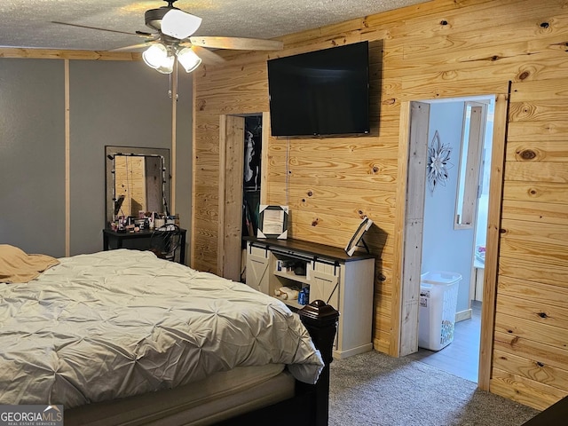 536 Gov Seay Rd, Collins, GA 30421 - bedroom featuring wood walls, carpet floors, and a ceiling fan