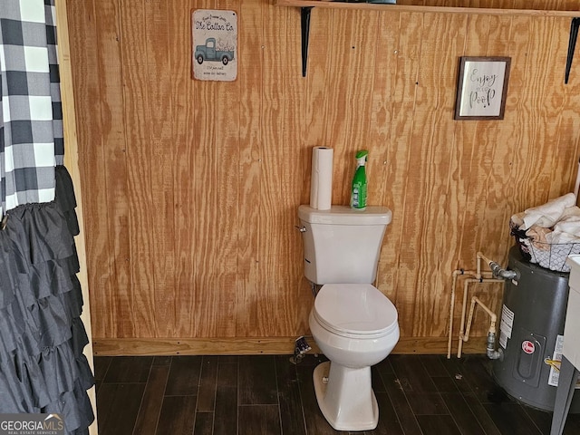 536 Gov Seay Rd, Collins, GA 30421 - bathroom with toilet, wood finished floors, and wood walls