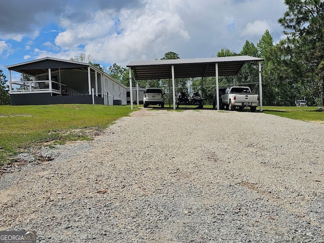 536 Gov Seay Rd, Collins, GA 30421 - view of car parking with a carport and driveway